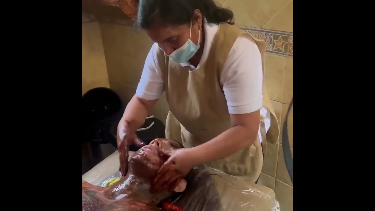 6ix9ine recieving a chocolate massage in Ecuador